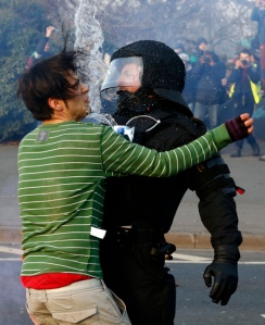 A policeman stops a 'Blockupy' anti-capitalist protester near the European Central Bank (ECB) building before the official opening of its new headquarters in Frankfurt
